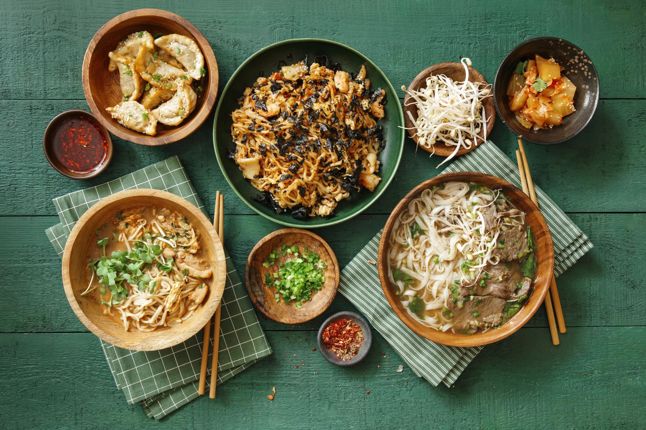 International soups and noodle dishes arranged from above