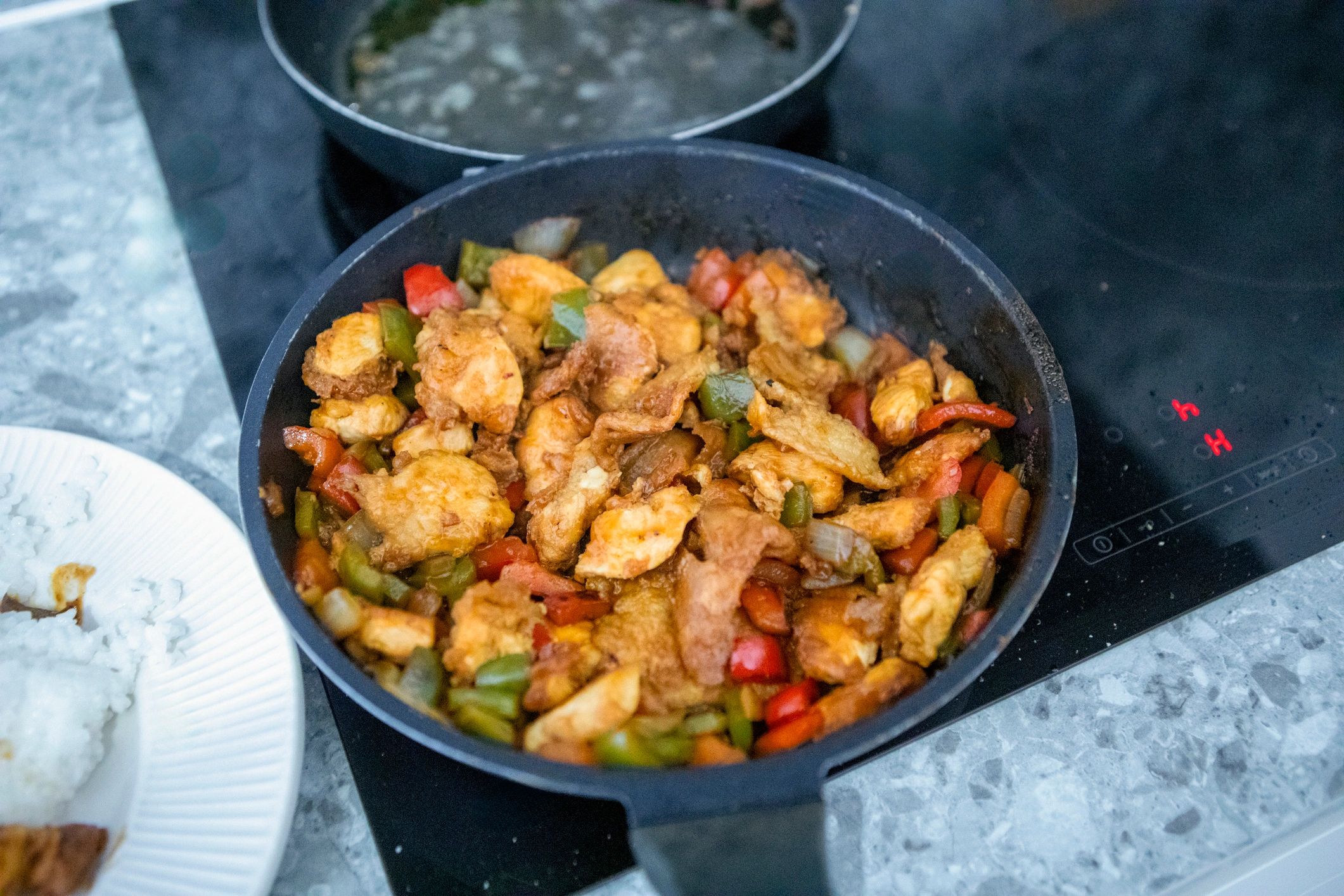 Stir-fried chicken main dish in a pan